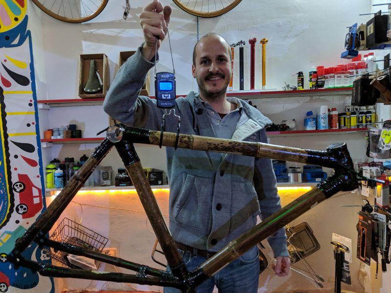File:Bamboo bike workshop end of day 2 weighing frame.jpg